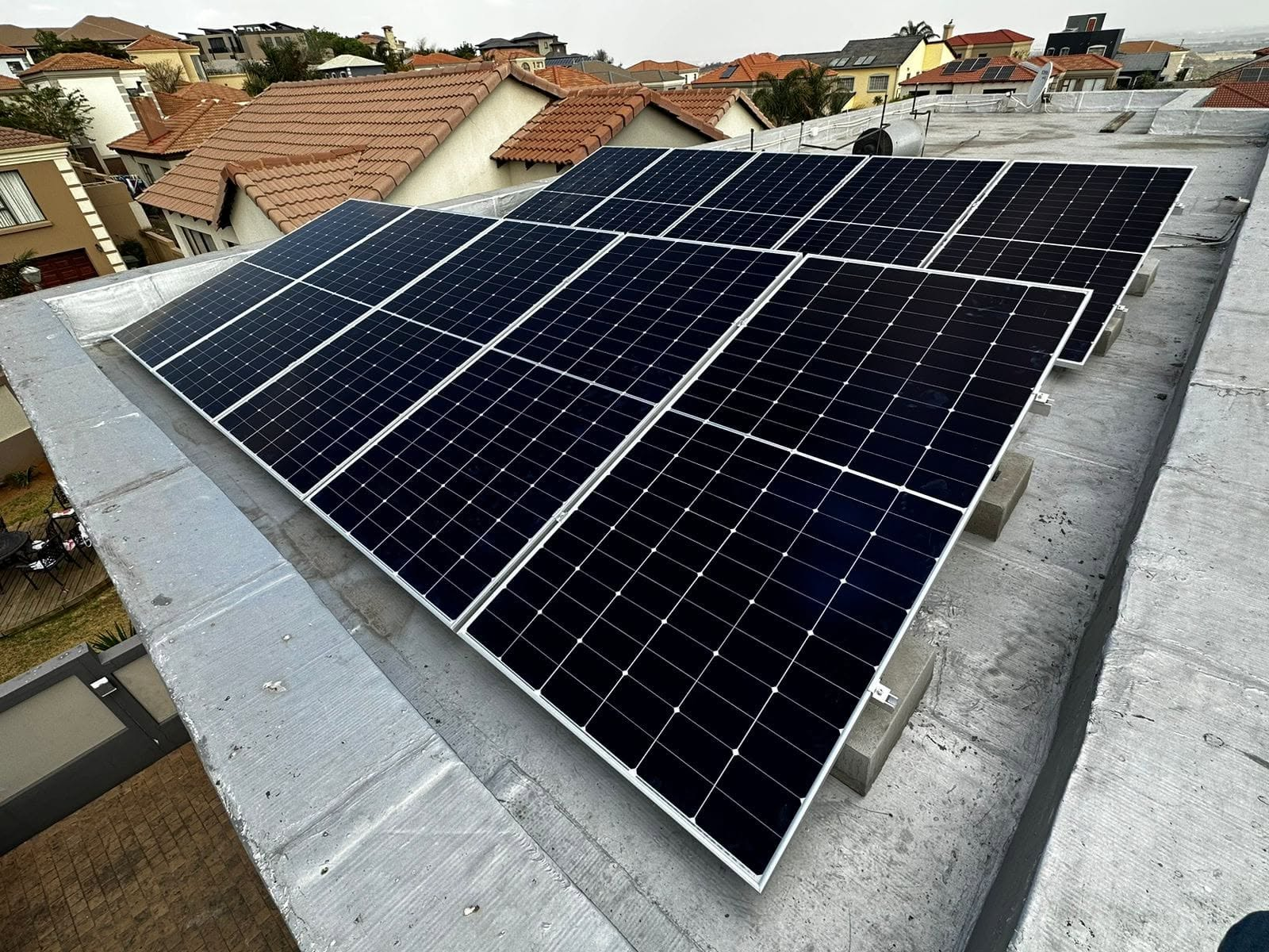 Rooftop solar array on flat concrete roof in Gauteng
